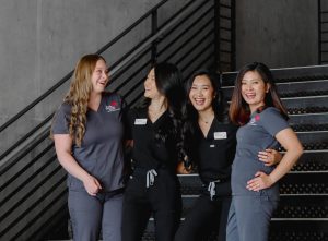 group of nurses smiling and laughing